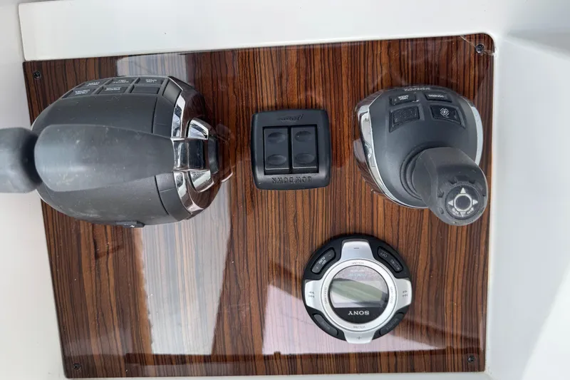 Slide: The Image of 2012 Cruisers Yachts 48 Cantius control panel with joystick and audio system. - 44