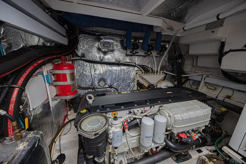 Slide: The Image of Engine room of 2012 Cruisers Yachts 48 Cantius with visible machinery and fire extinguisher. - 47