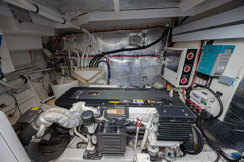 Slide: The Image of Engine room of 2012 Cruisers Yachts 48 Cantius with technical components. - 48