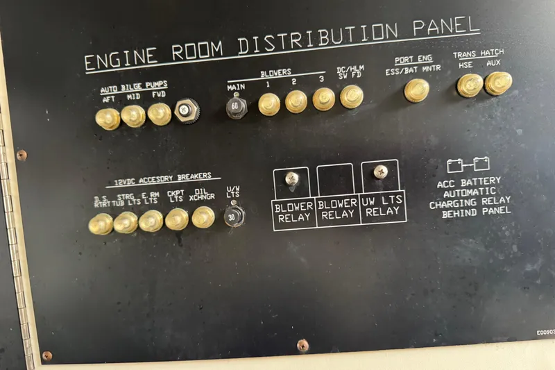 Slide: The Image of 2012 Cruisers Yachts 48 Cantius engine room distribution panel with switches and relays. - 53