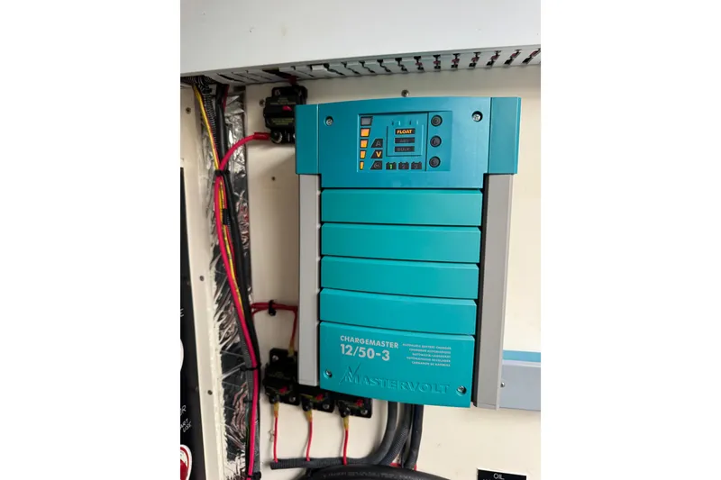 Slide: The Image of Mastervolt battery charger in 2012 Cruisers Yachts 48 Cantius, model 12/50-3. - 56