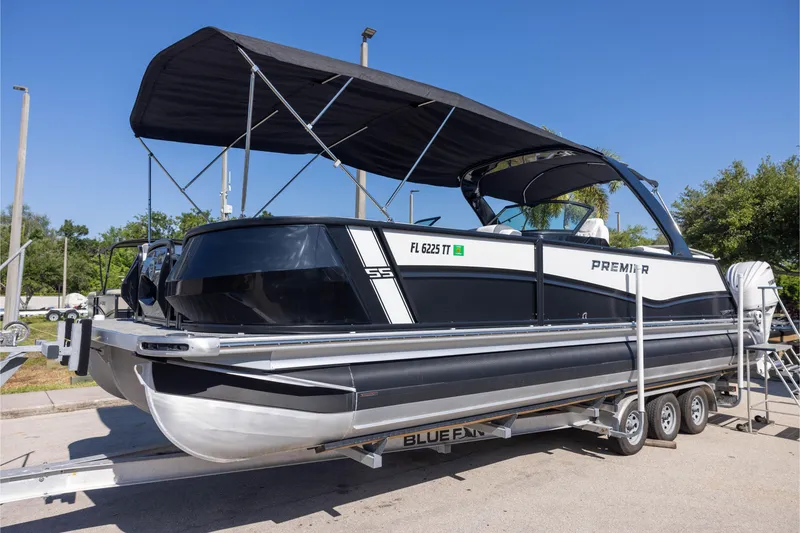 The Image of 2024 Premier 270 Super Sport boat on trailer under blue sky. - 0