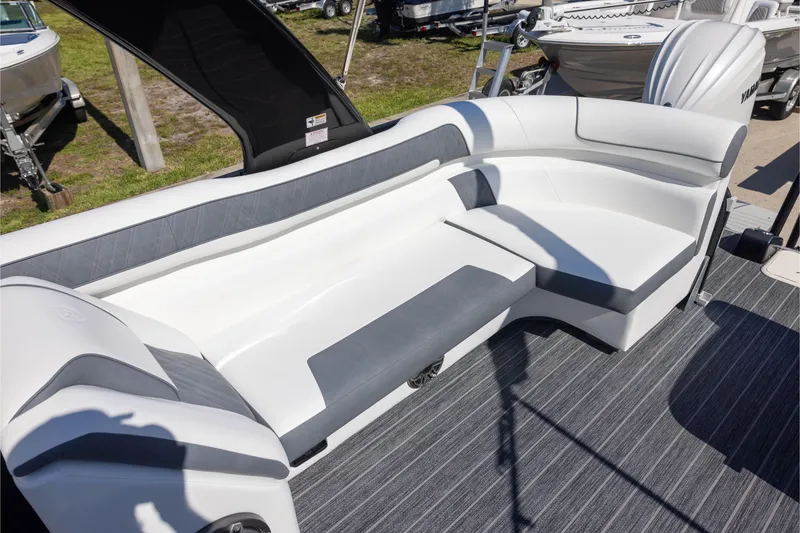 Slide: The Image of 2024 Premier 270 Super Sport boat interior with sleek white and gray seating. - 10