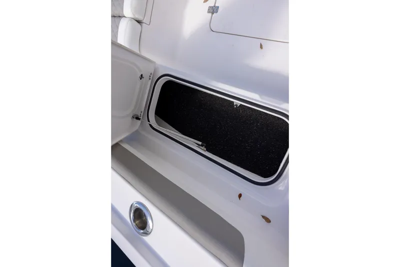 Slide: The Image of Open storage compartment on 2022 Caymas 28 HB Twin boat. - 15
