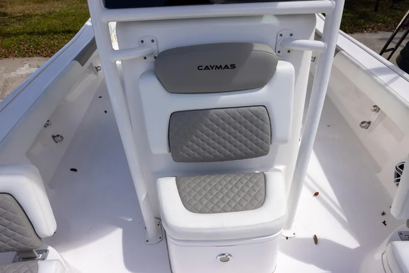 Slide: The Image of Caymas 28 HB Twin 2022 boat seating with gray quilted cushions. - 16