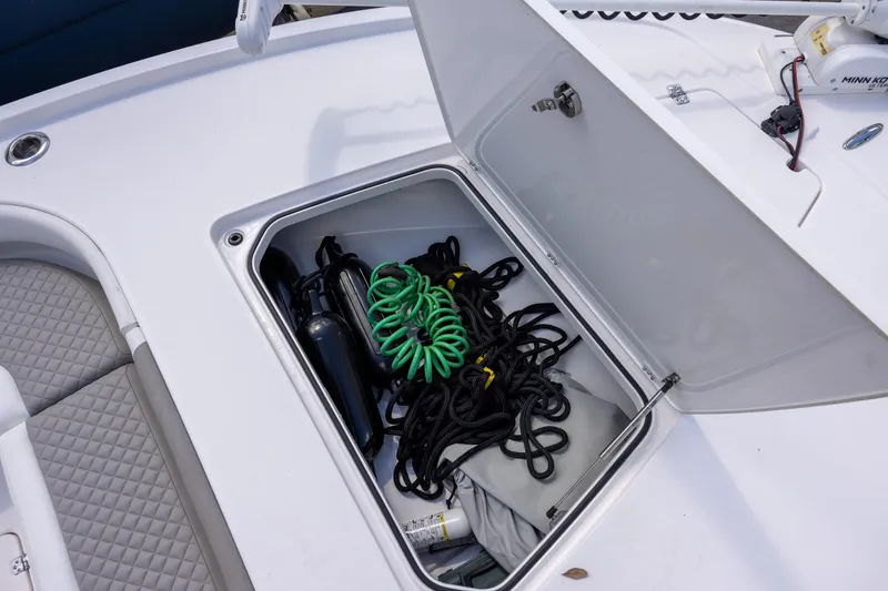 Slide: The Image of Storage compartment on 2022 Caymas 28 HB Twin boat with ropes and equipment. - 18