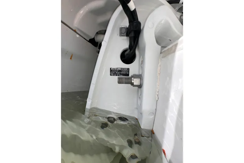 Slide: The Image of Engine compartment of a 2007 Intrepid 310 Walkaround with visible Suzuki component. - 18