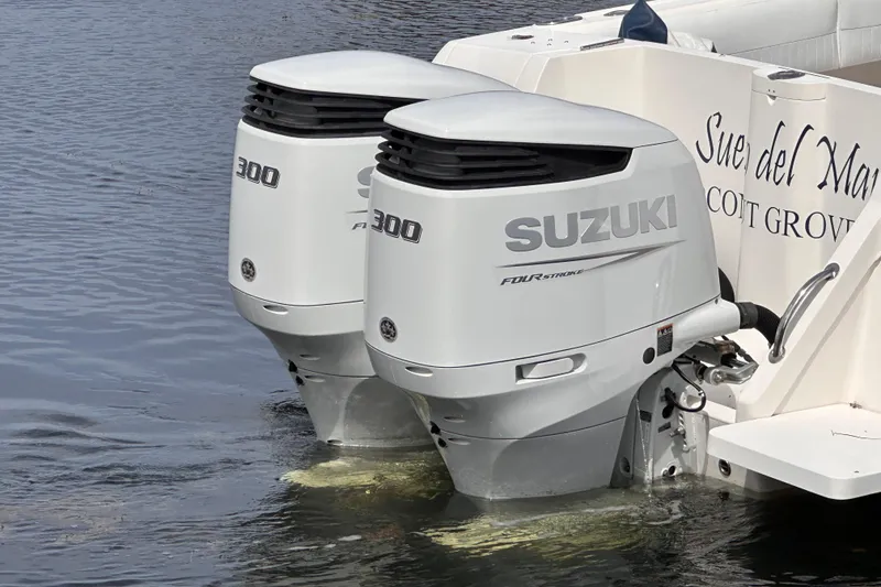 Slide: The Image of Twin Suzuki 300 outboard engines on a 2007 Intrepid 310 Walkaround boat. - 23