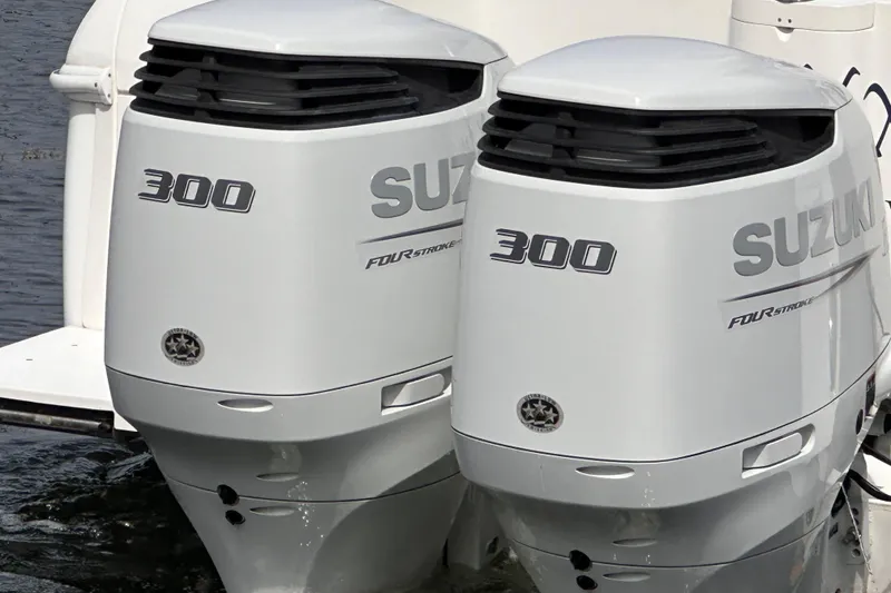 Slide: The Image of Twin Suzuki 300 outboard engines on a 2007 Intrepid 310 Walkaround boat. - 24