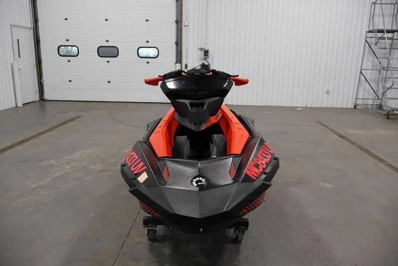 Slide: The Image of 2022 Sea-Doo Spark for 2 jet ski in a garage setting. - 2