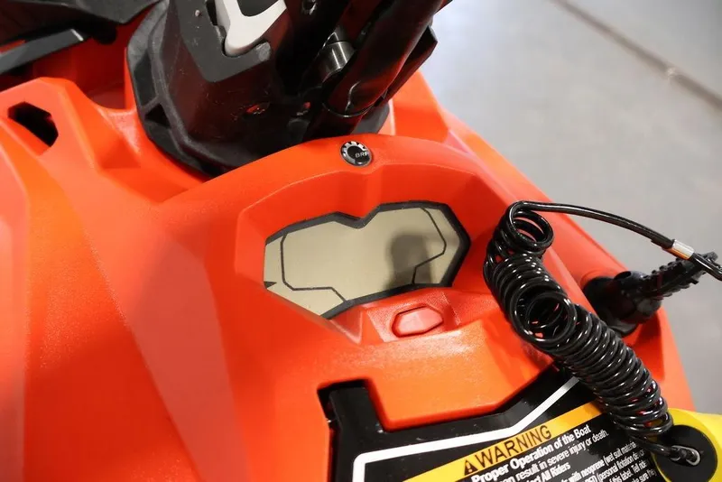 Slide: The Image of 2022 Sea-Doo Spark for 2 dashboard with vibrant orange design and safety warning label. - 5