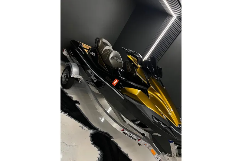 Slide: The Image of 2023 Kawasaki Jetski Ultra 310LX in sleek showroom, showcasing modern design and luxury features. - 3
