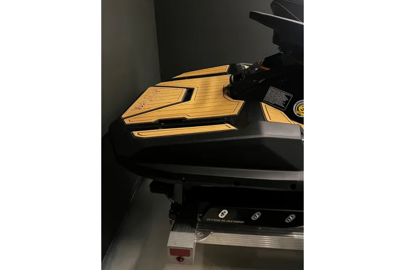 Slide: The Image of 2023 Kawasaki Jetski Ultra 310LX with sleek design and wooden accents. - 7
