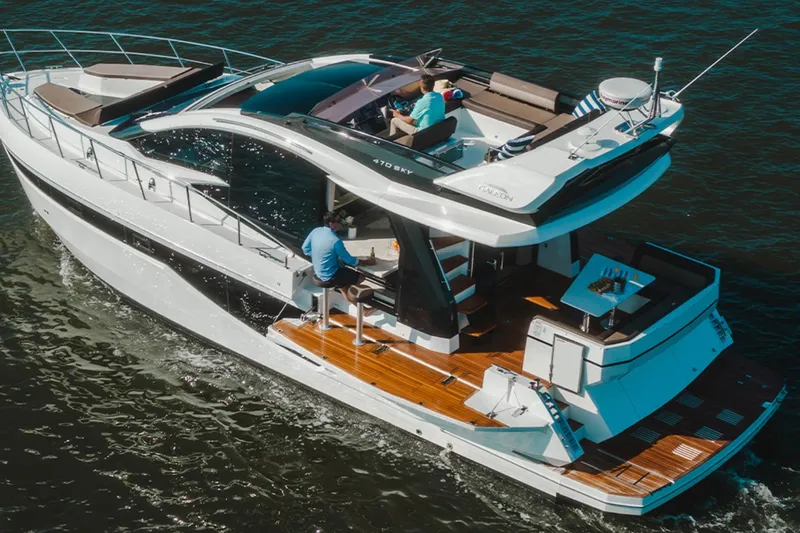 The Image of 2024 Galeon 470 Sky yacht cruising on water, featuring sleek design and spacious deck. - 0
