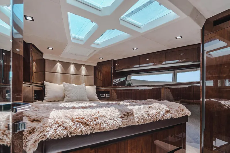 Slide: The Image of Luxurious interior of 2024 Galeon 470 Sky yacht with plush bedding and skylights. - 10
