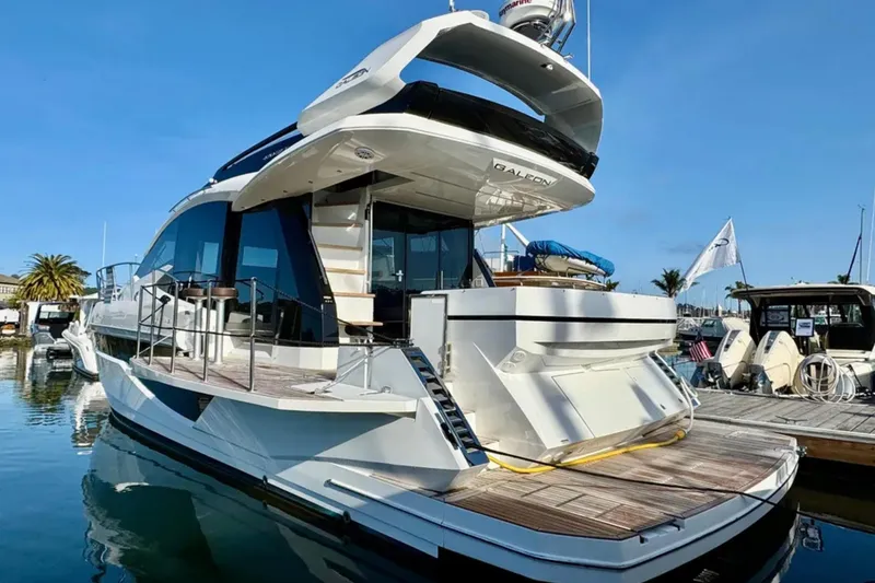 Slide: The Image of 2024 Galeon 470 Sky yacht docked at marina, showcasing sleek design and modern features. - 3