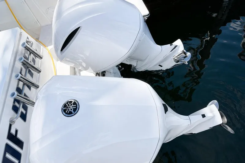 Slide: The Image of Twin Yamaha outboard engines on a 2016 Pursuit OS 325 Offshore boat. - 18