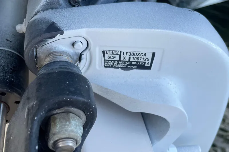 Slide: The Image of Close-up of Yamaha LF300XCA engine part on 2016 Pursuit OS 325 Offshore boat. - 20
