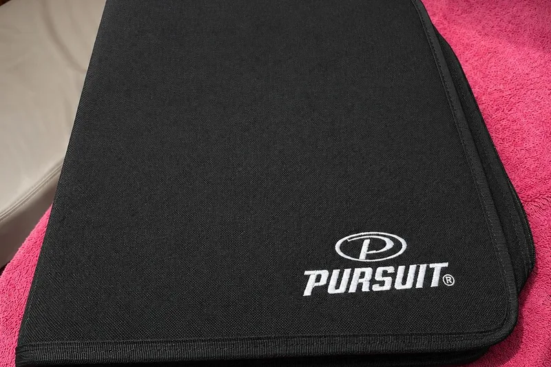 Slide: The Image of Black Pursuit OS 325 Offshore 2016 manual on pink towel. - 22