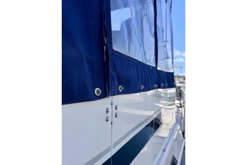 Slide: The Image of Close-up of 1985 Californian 35 Motor Yacht with blue canvas cover. - 17