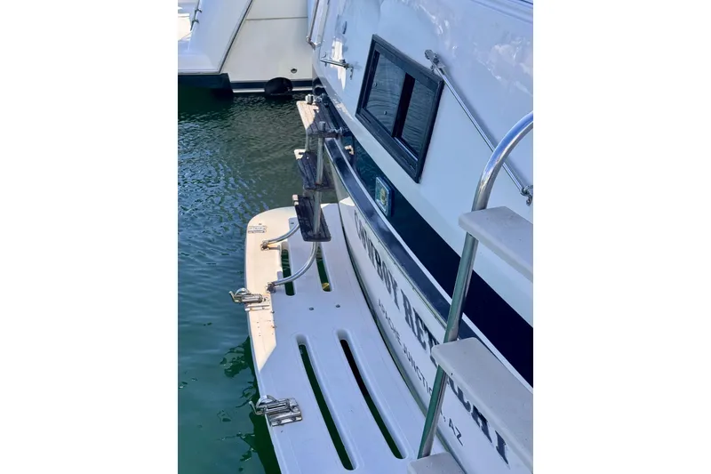 Slide: The Image of 1985 Californian 35 Motor Yacht stern view with swim platform and ladder. - 20