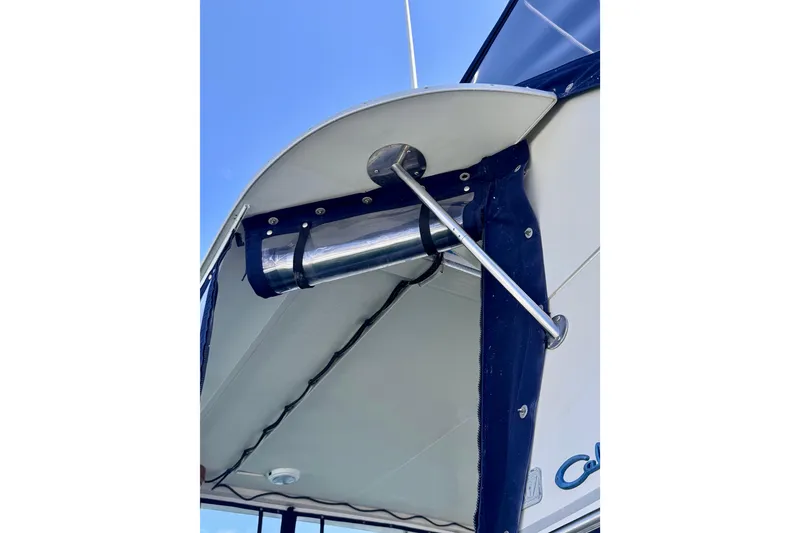 Slide: The Image of 1985 Californian 35 Motor Yacht canopy detail with blue trim and metal support. - 22