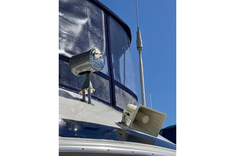 Slide: The Image of 1985 Californian 35 Motor Yacht spotlight and antenna against clear blue sky. - 23