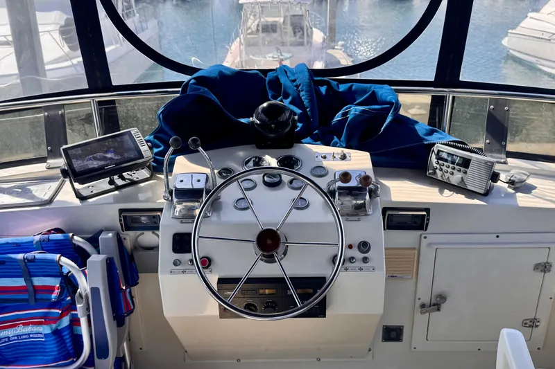 Slide: The Image of Helm of 1985 Californian 35 Motor Yacht with steering wheel and navigation equipment. - 29