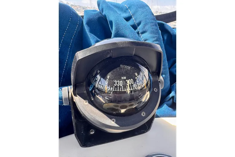 Slide: The Image of Compass on 1985 Californian 35 Motor Yacht, surrounded by blue fabric. - 36