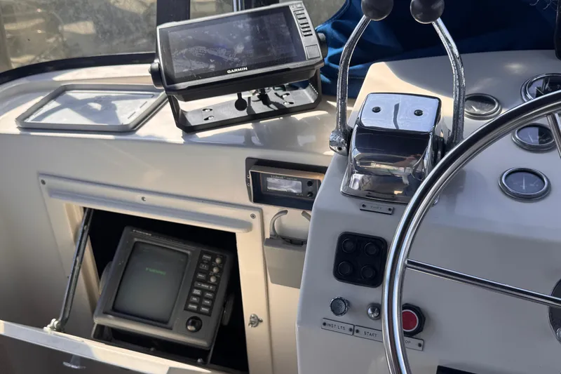Slide: The Image of Control panel of a 1985 Californian 35 Motor Yacht with navigation equipment. - 37