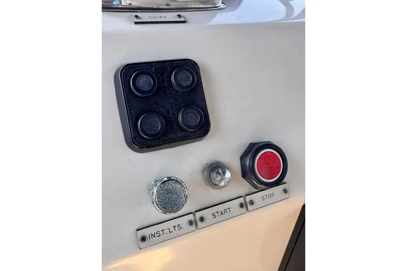 Slide: The Image of Control panel of a 1985 Californian 35 Motor Yacht with buttons and switches. - 39