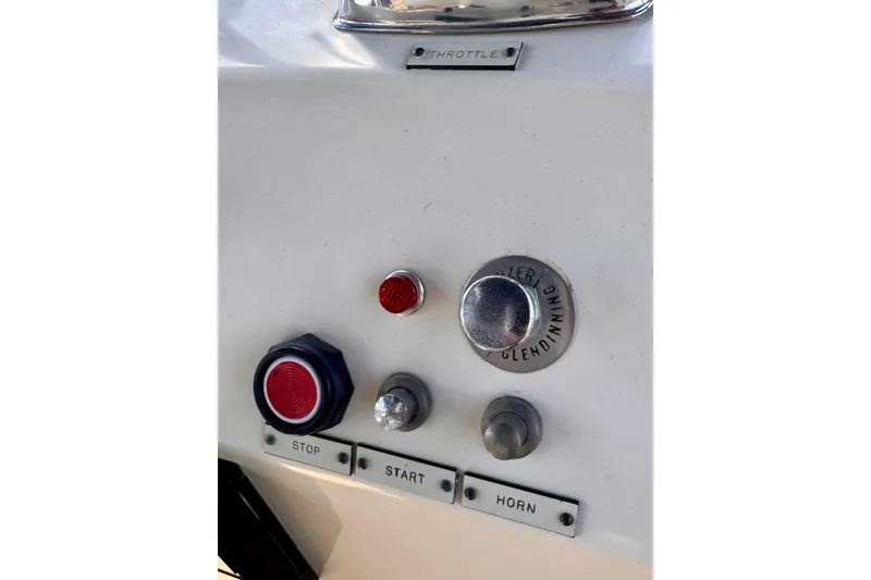 Slide: The Image of Control panel of a 1985 Californian 35 Motor Yacht with throttle, start, stop, and horn buttons. - 40