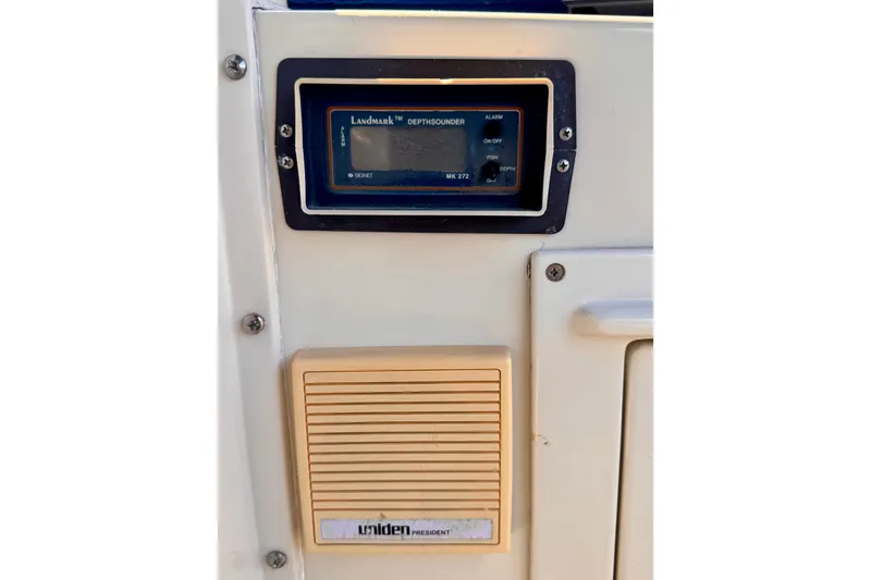 Slide: The Image of Depth sounder and speaker on 1985 Californian 35 Motor Yacht dashboard. - 41