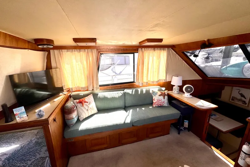 Slide: The Image of Interior of 1985 Californian 35 Motor Yacht with cozy seating and decor. - 46