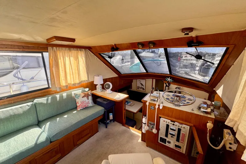 Slide: The Image of Interior of a 1985 Californian 35 Motor Yacht with helm and seating area. - 47