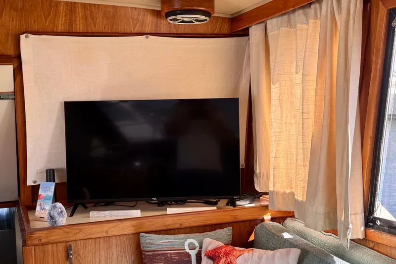 Slide: The Image of Interior of 1985 Californian 35 Motor Yacht with TV and cozy seating area. - 54