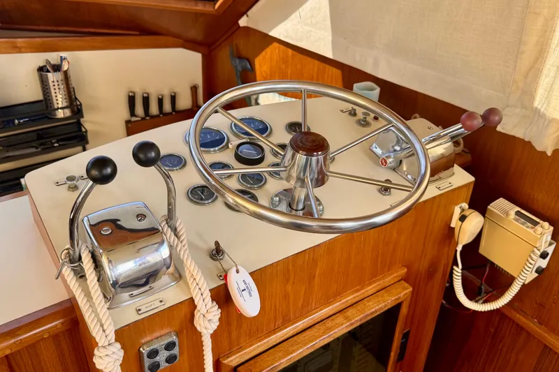 Slide: The Image of Helm of 1985 Californian 35 Motor Yacht with steering wheel and controls. - 59