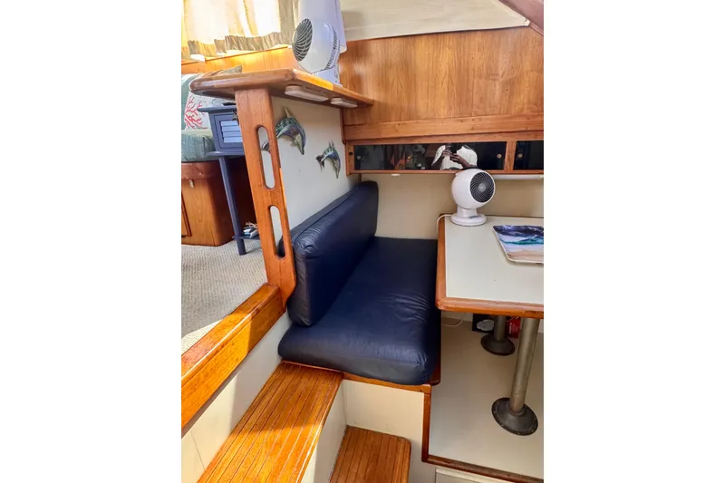 Slide: The Image of Interior of 1985 Californian 35 Motor Yacht with seating, table, and decor. - 67