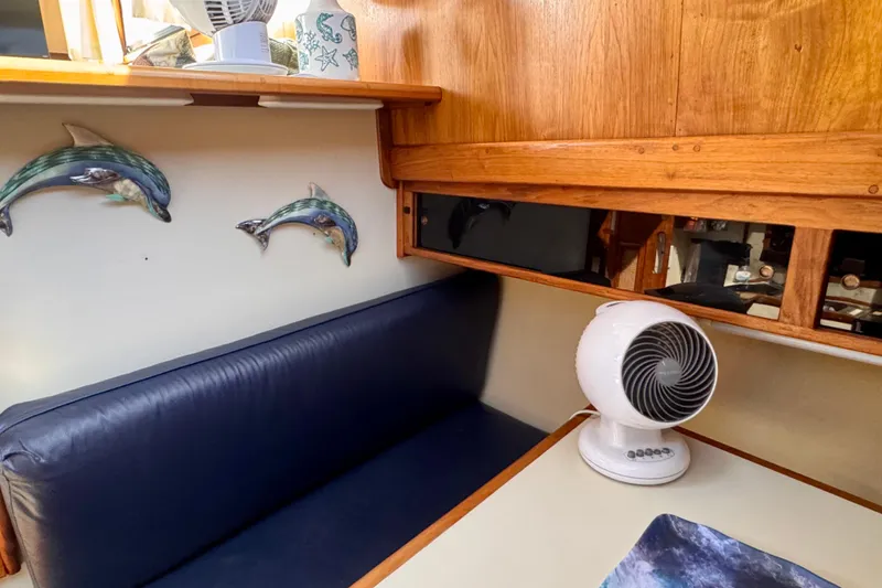 Slide: The Image of Interior of 1985 Californian 35 Motor Yacht with dolphin decor and fan. - 70