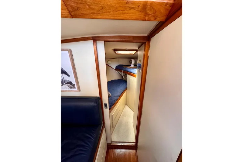 Slide: The Image of Interior of 1985 Californian 35 Motor Yacht with cozy cabin and wooden accents. - 72