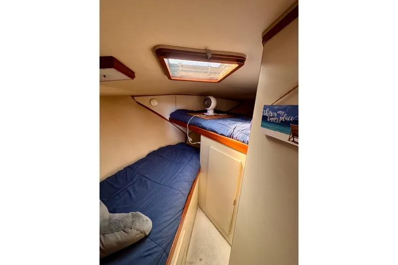Slide: The Image of Cozy cabin interior of 1985 Californian 35 Motor Yacht with twin beds and skylight. - 73