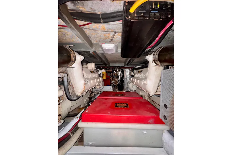 Slide: The Image of Engine room of a 1985 Californian 35 Motor Yacht with visible machinery and components. - 84