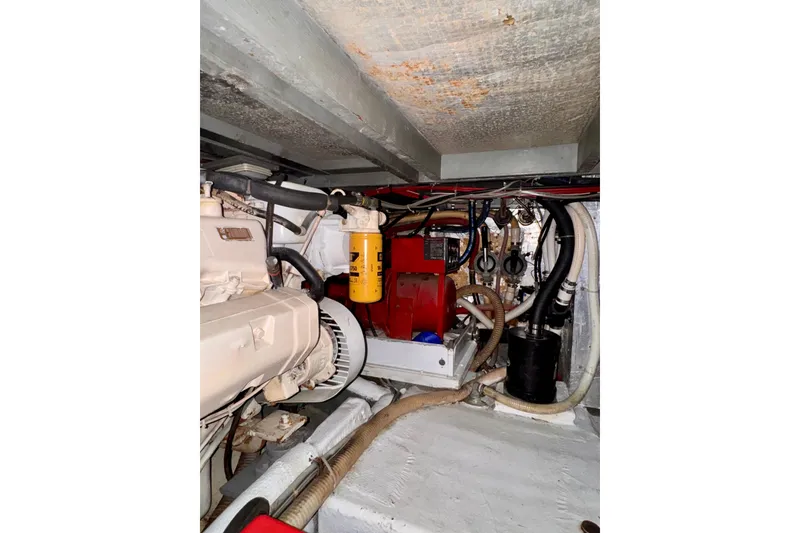 Slide: The Image of Engine room of 1985 Californian 35 Motor Yacht with visible machinery and components. - 90