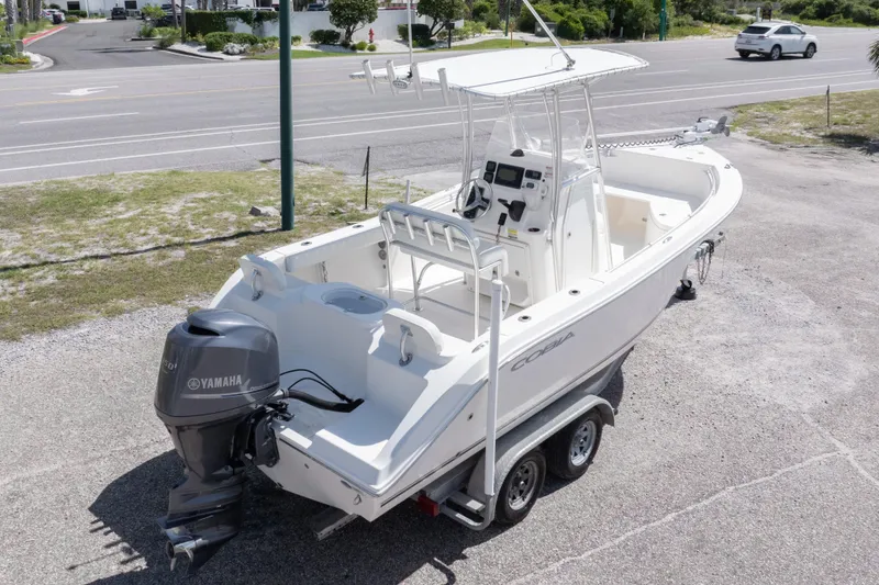 Slide: The Image of 2014 Cobia 214 Center Console boat on trailer with Yamaha outboard motor. - 10