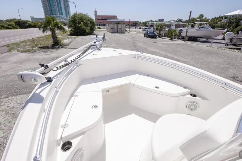 Slide: The Image of 2014 Cobia 214 Center Console boat with spacious seating and modern design. - 34