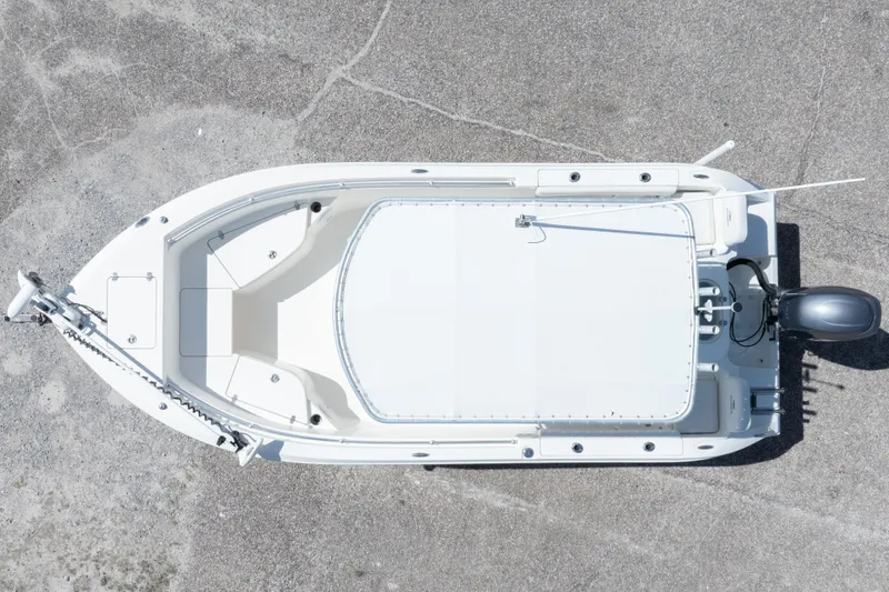 Slide: The Image of Overhead view of a 2014 Cobia 214 Center Console boat on concrete surface. - 5