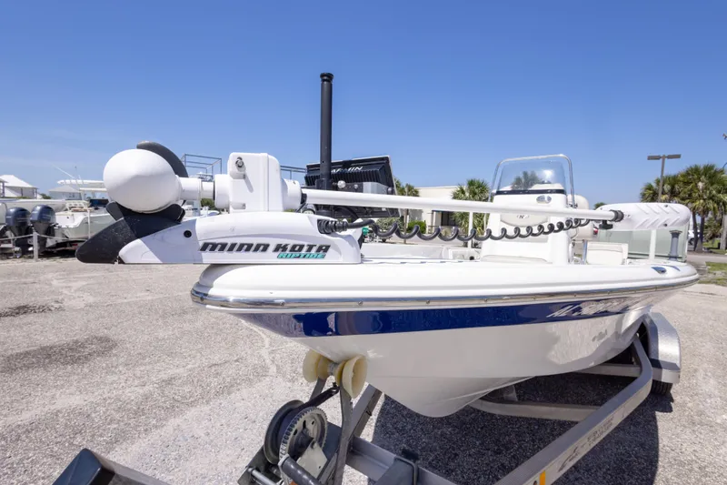 Slide: The Image of 2015 NauticStar 214 XTS boat with Minn Kota trolling motor on trailer. - 21