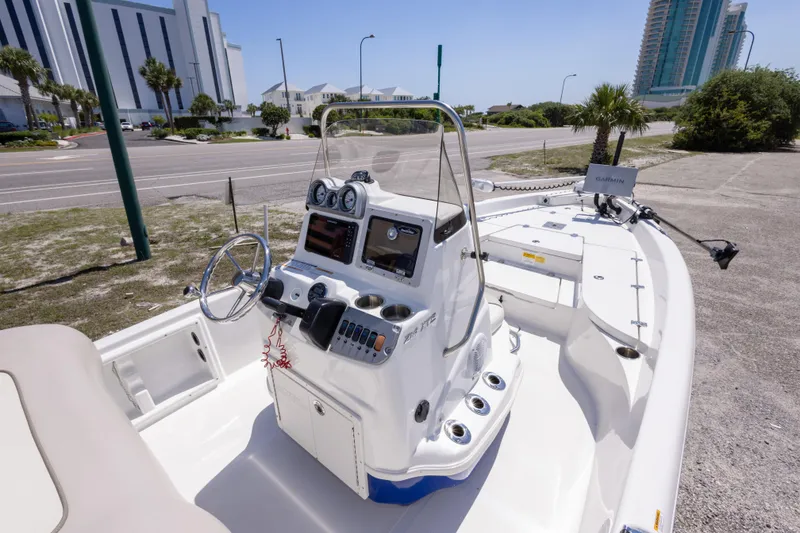 Slide: The Image of 2015 NauticStar 214 XTS boat with modern dashboard and Garmin navigation system. - 23