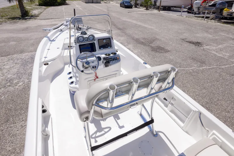 Slide: The Image of 2015 NauticStar 214 XTS boat interior with steering console and rod holders. - 26