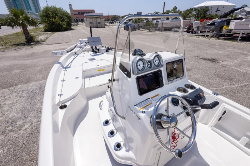 Slide: The Image of 2015 NauticStar 214 XTS boat with modern dashboard and steering wheel. - 29